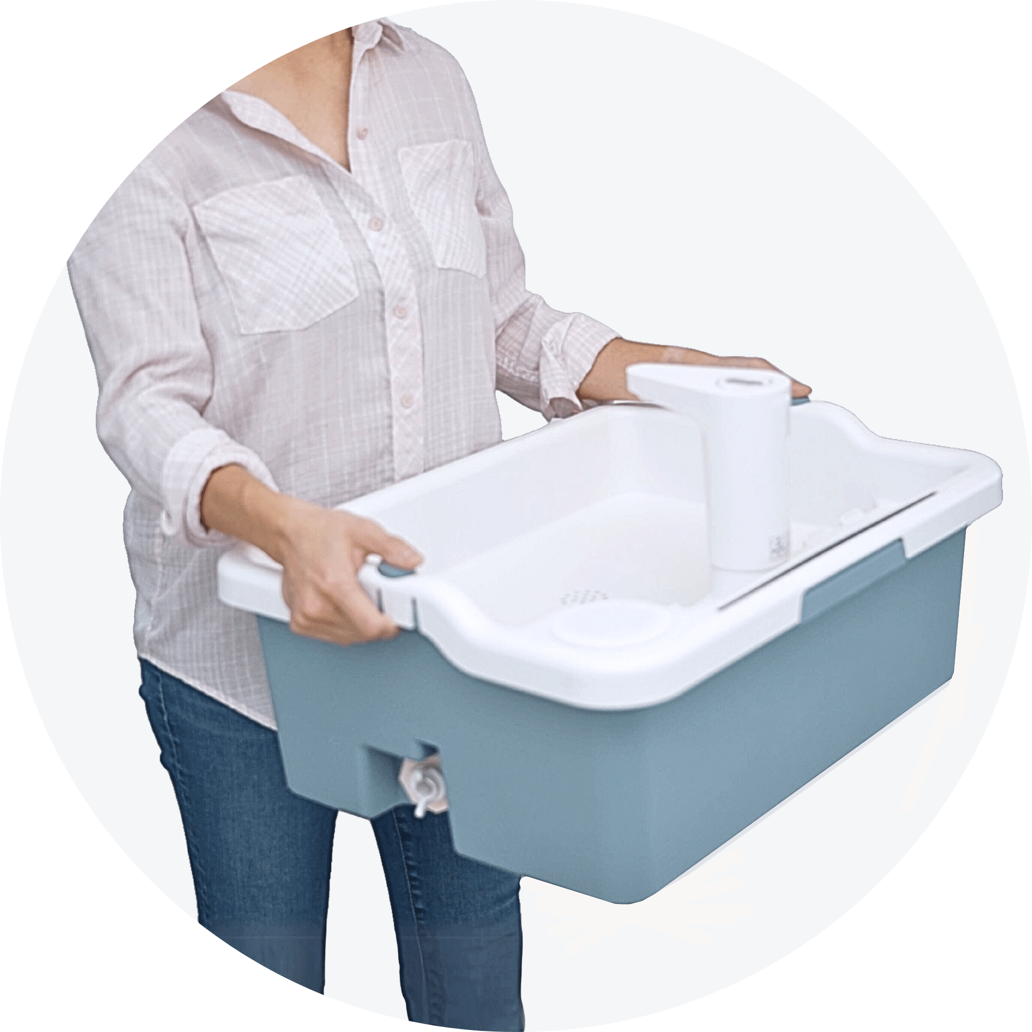 Woman carrying Mighty Sink indoor and outdoor portable sink